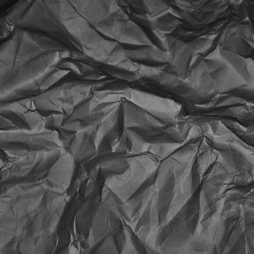 Crumpled black paper texture background, abstract design