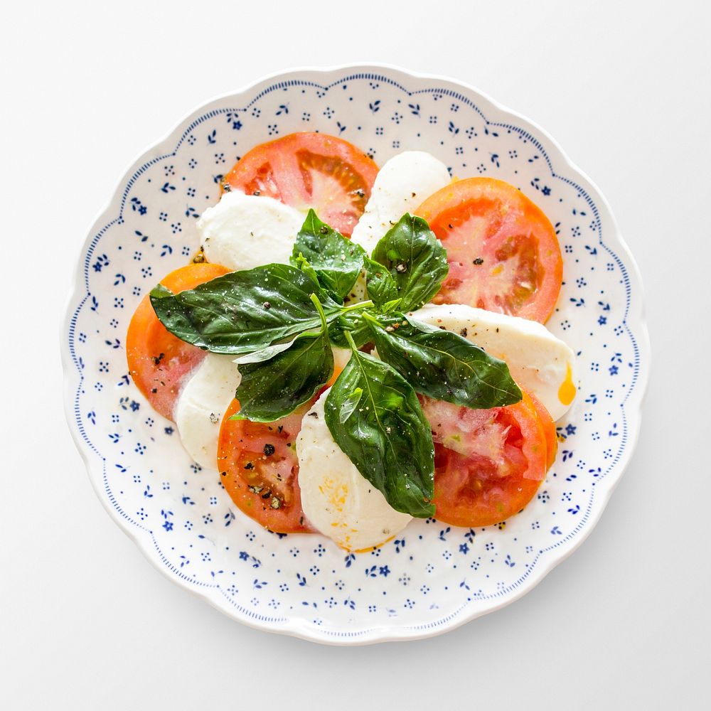 Caprese salad on plate, food photography psd