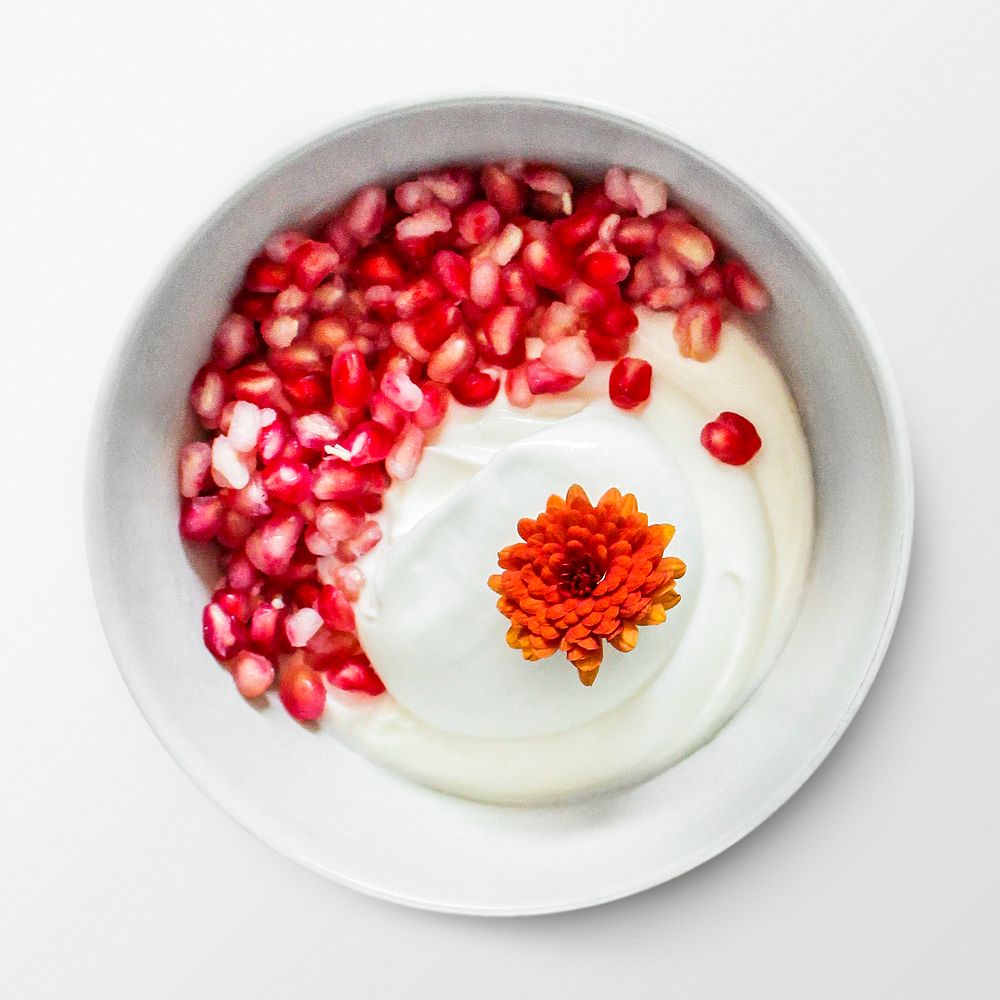 Yogurt with pomegranate in a bowl, food photography psd