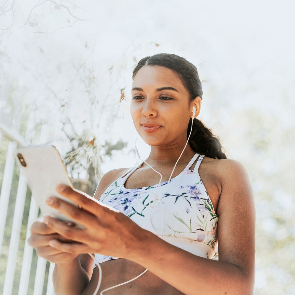 Woman using mobile phone, 5G technology