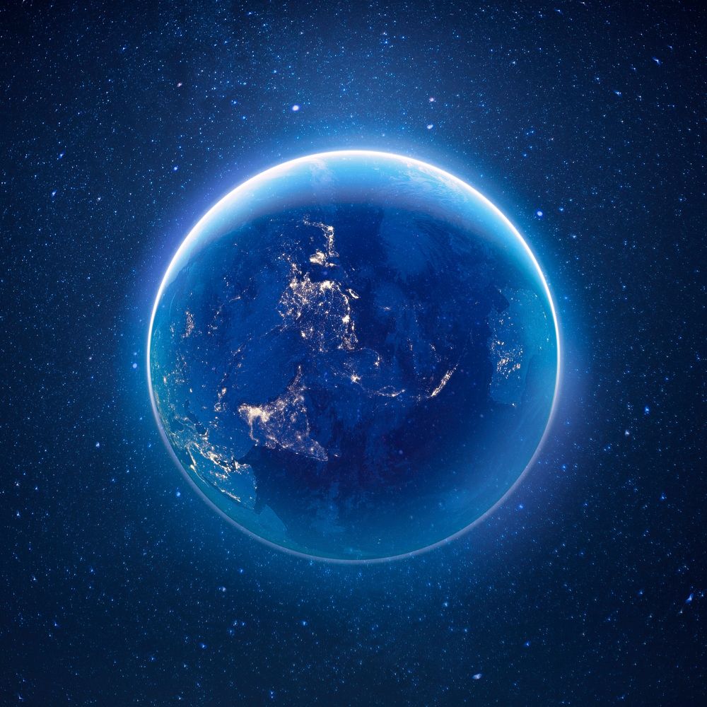 Glowing planet Earth in space, blue background psd