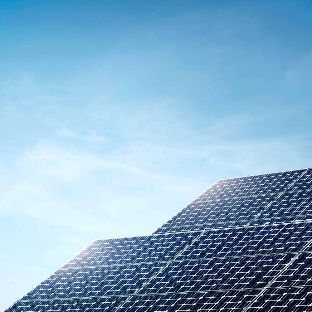 Solar panels with blue sky, renewable energy technology background