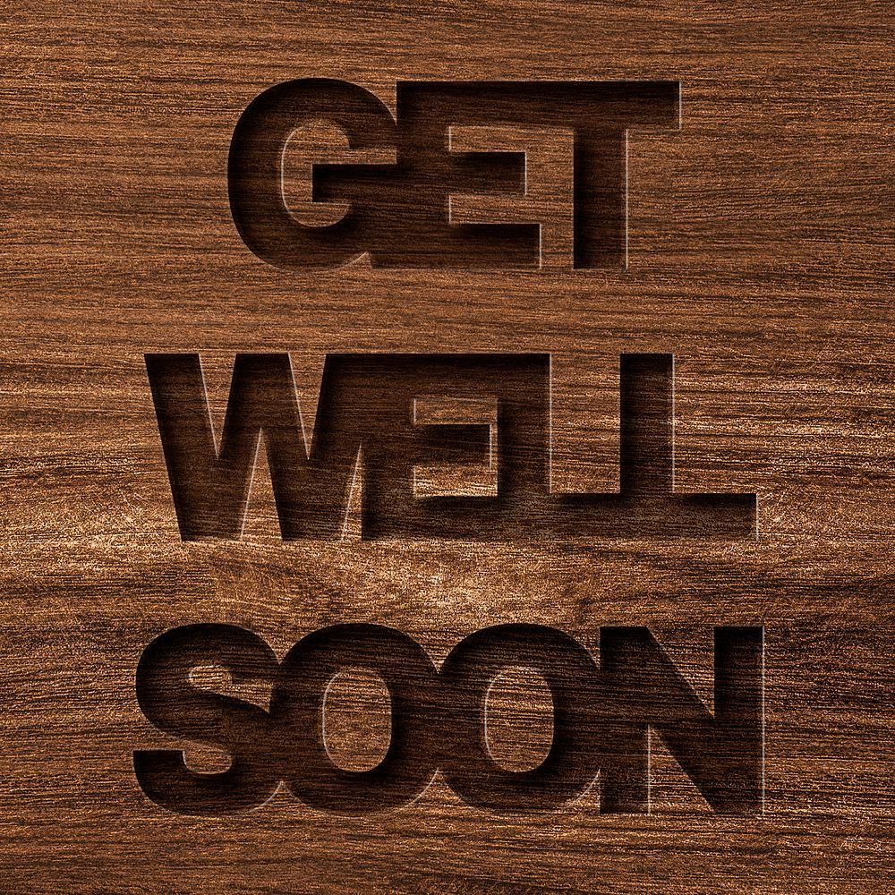 Get well soon engraved wood typography on wooden background