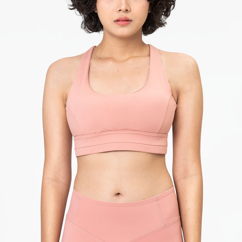 Woman in pink sports bra and leggings with design space set
