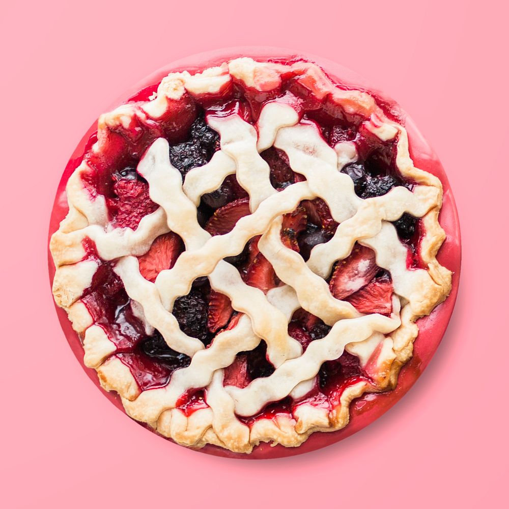 Mixed berry pie on pink background, food photography