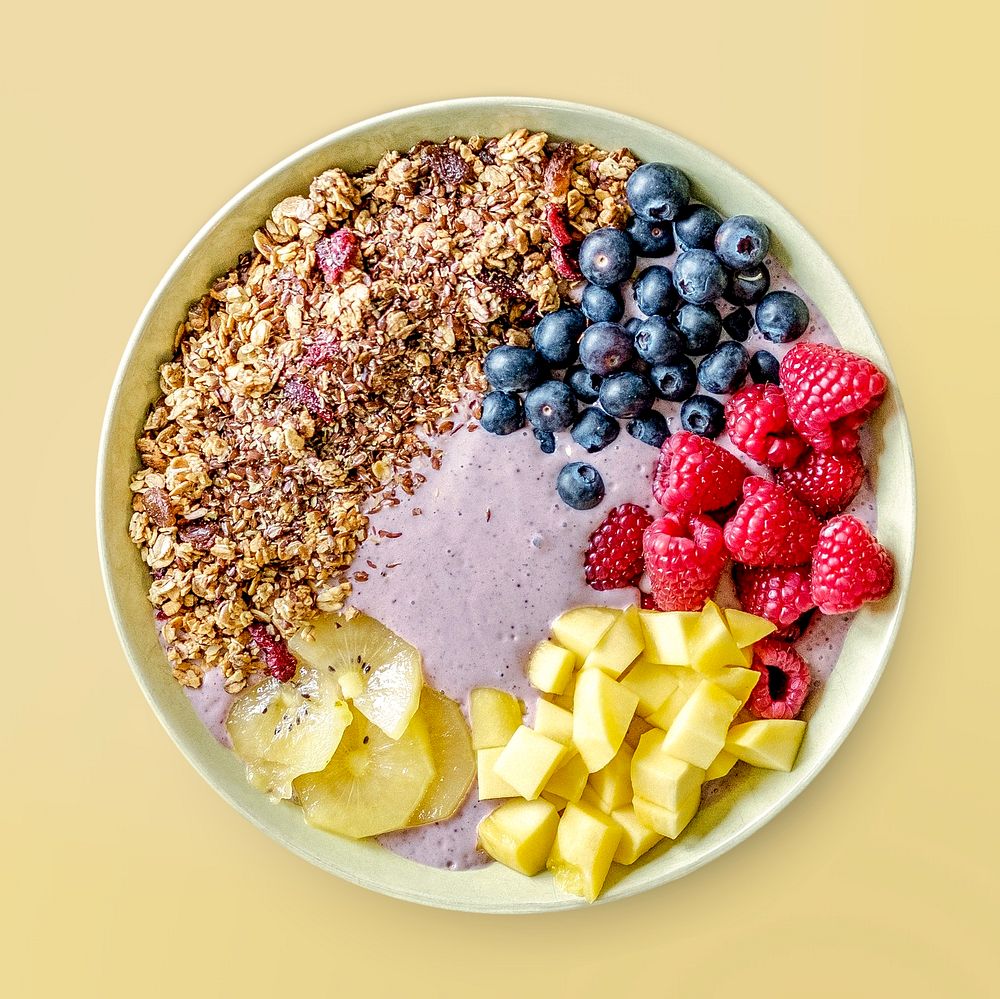 Smoothie bowl on yellow background, food photography, flat lay style