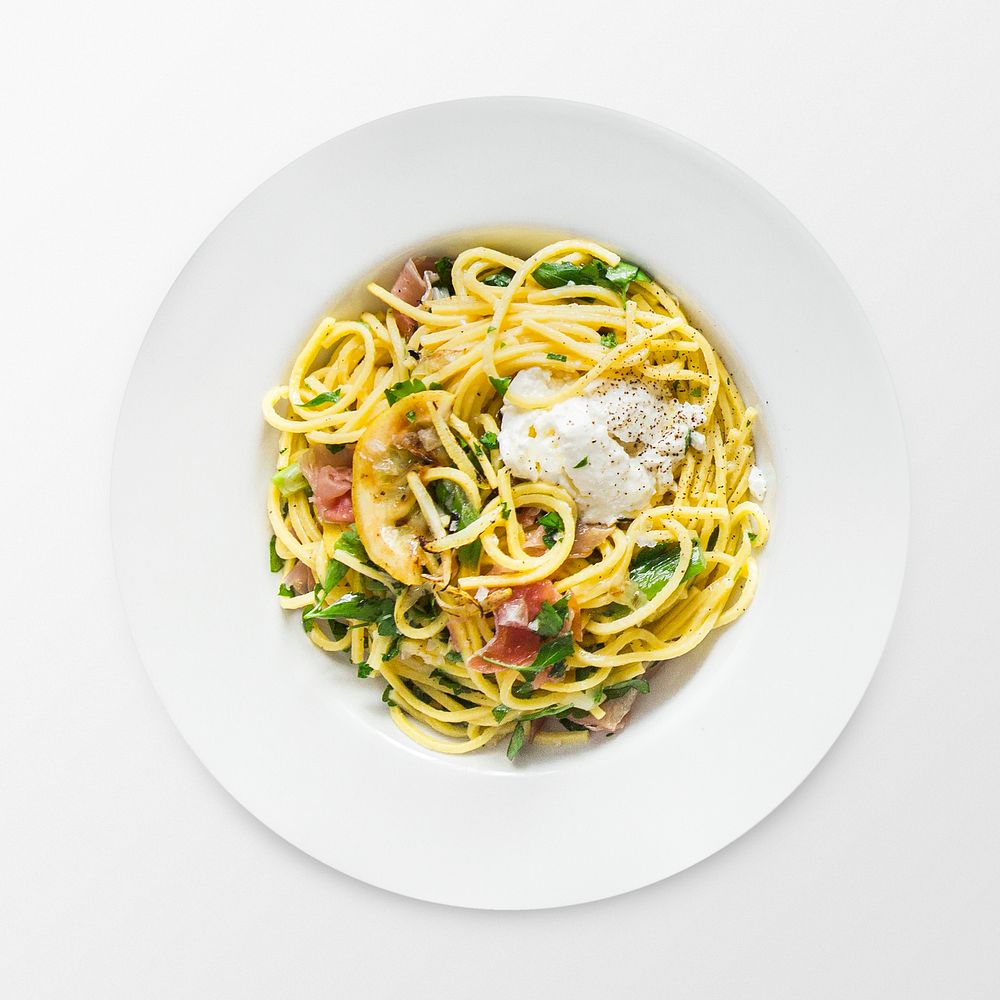 Spaghetti carbonara on a plate, food photography, flat lay style